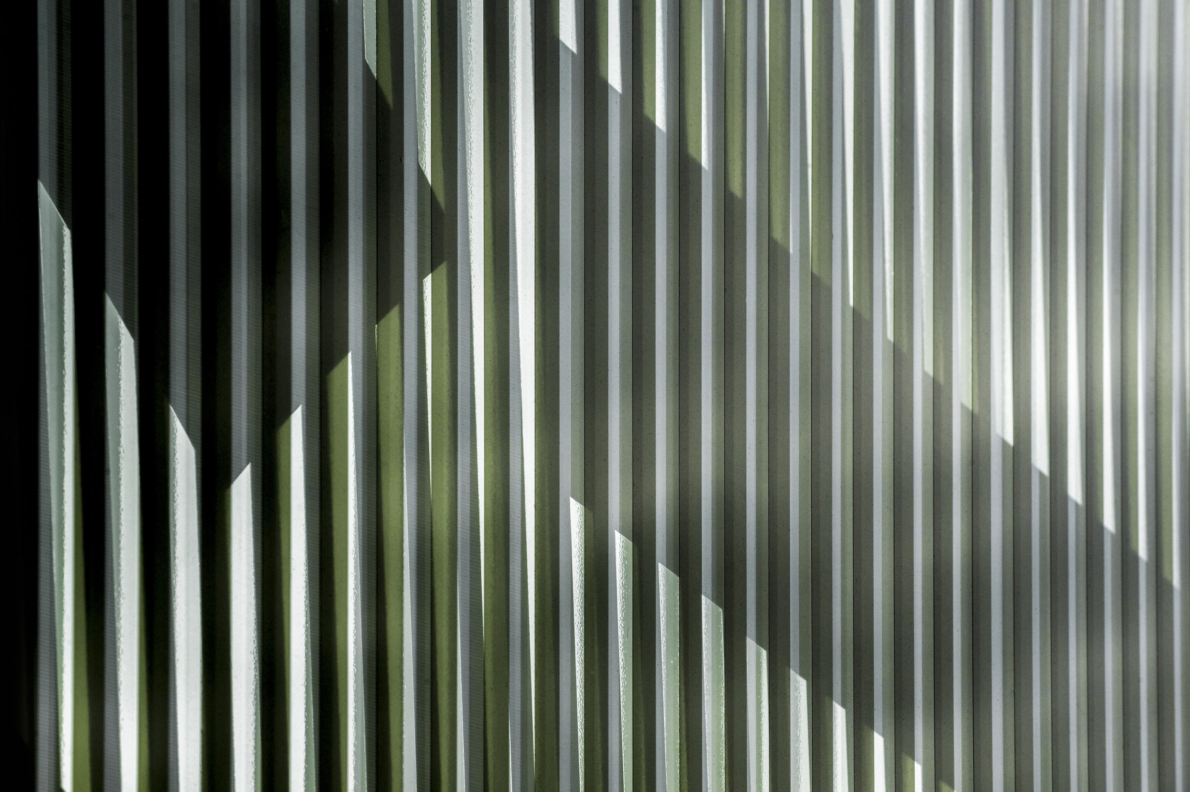 Wall with vertical lines and shadows